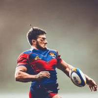 Enthusiastic rugby player in the process of a try